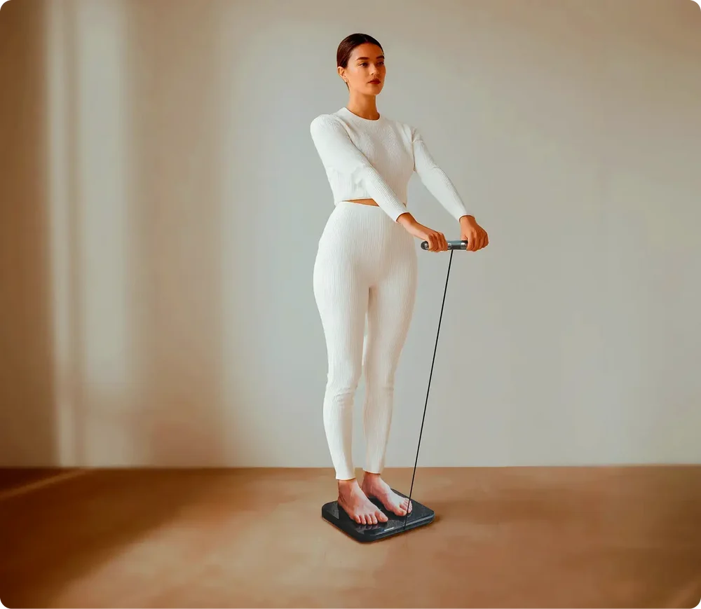 Woman using the Hume Pod with handheld sensor